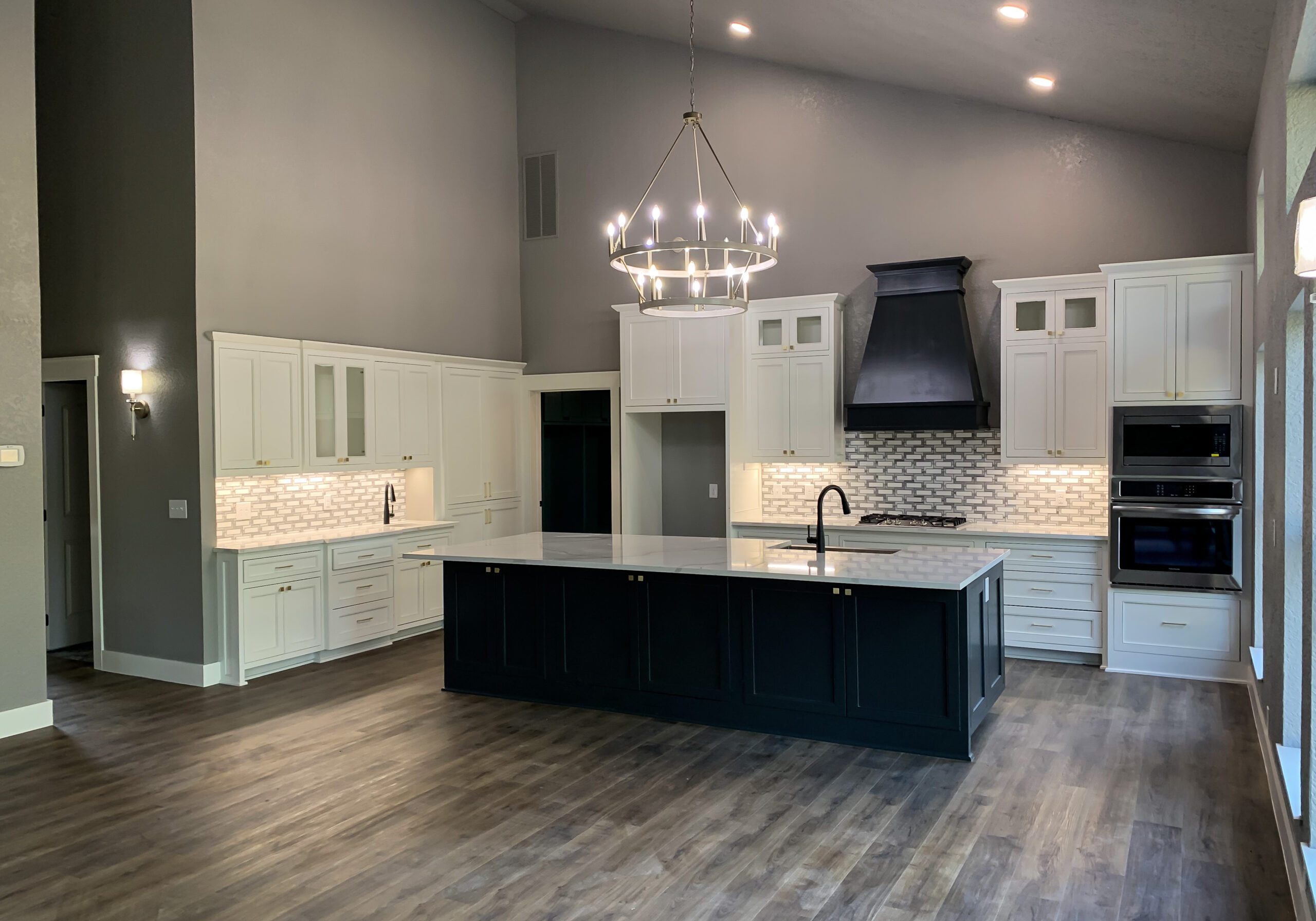 Full Kitchen with White Shaker Cabinets and Painted Maple Island